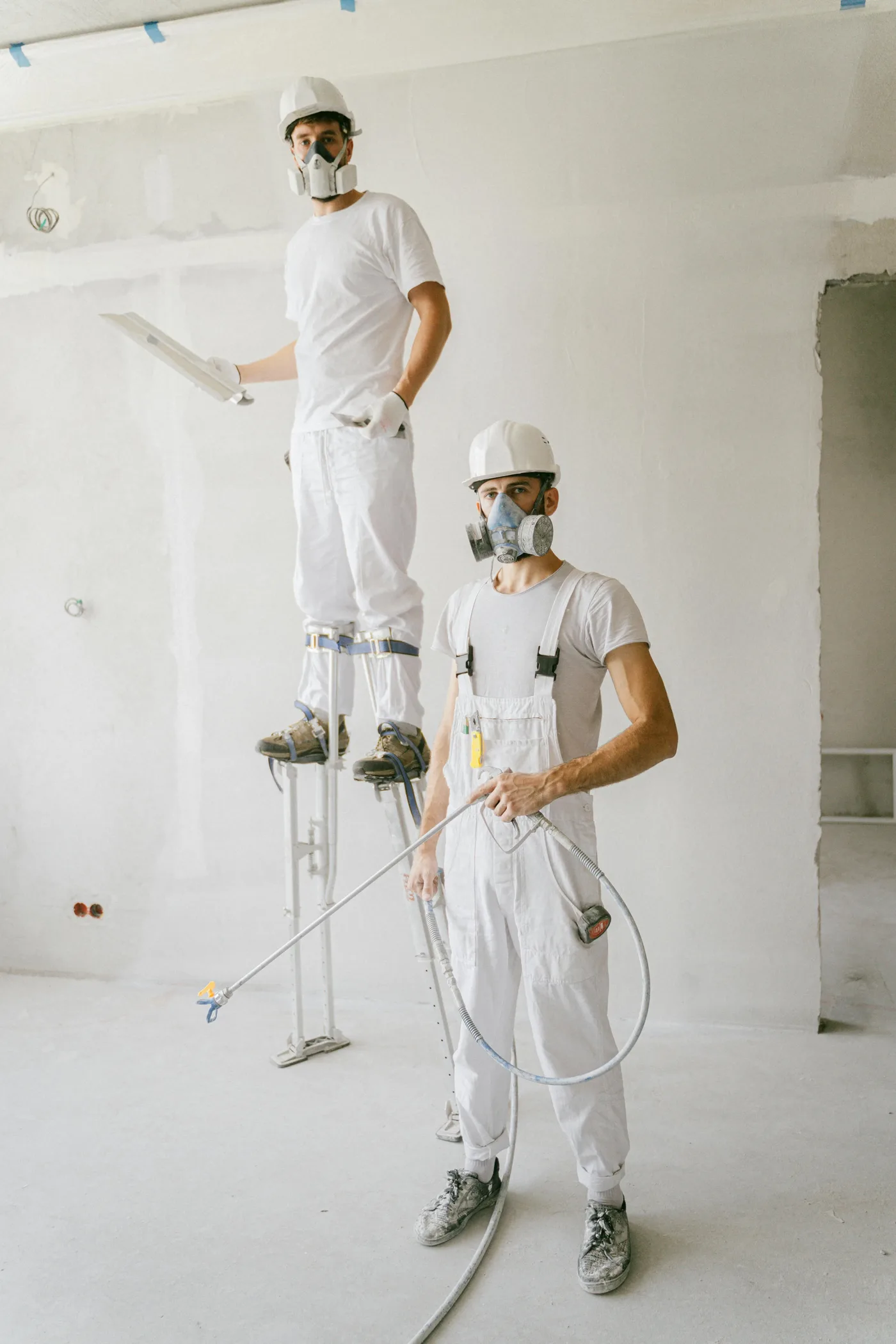 water damage restoration Raleigh North Carolina — technician extracting water from flooded living room